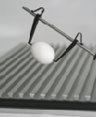 “Soft-touch” self-wedging tail-spring clamp